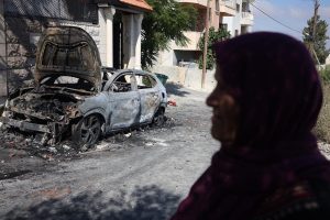 A vehicle set on fire by Israeli settlers in the Palestinian town of Jit, August 16 2024. (Photo by Oren Ziv)