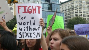 Poster saying "Fight for a world without sexism"