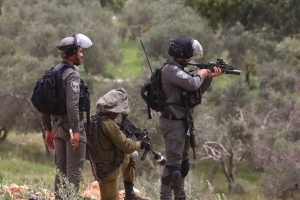 Palestinians react to the march organized by Israeli settlers held to demand legalization of the Avitar settlement outpost near the city of Nablus in West Bank, on April 10, 2023 [Nedal Eshtayah – Anadolu Agency]